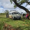 High-roof Toyota HiAce commuter passenger van available for group travel, corporate shuttles, and airport van hire services.