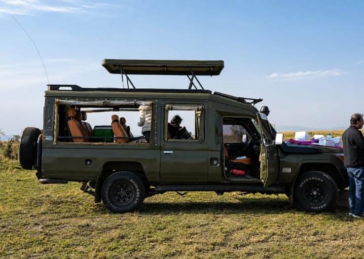 A parked Toyota Landcruiser safari tour at the Maasai Mara