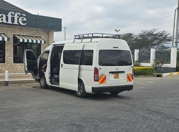 A van parked at Art Caffe Mai Mahiu for a short break on the way to Maasai Mara